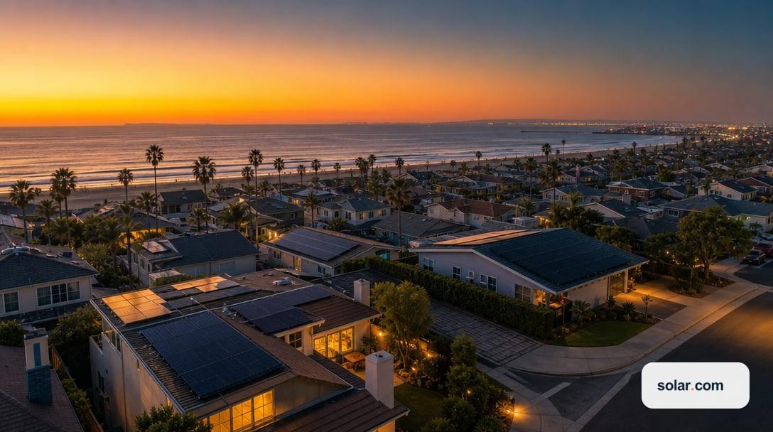 A wide aerial view of a Long Beach coastal residential neighborhood at dusk, rooftops with unbranded matte-black solar panels, palm trees,…