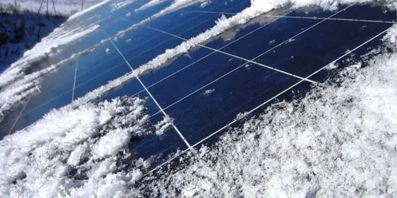 image of snow melting off of rooftop solar panels